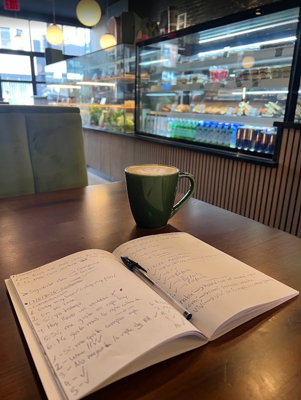A working notebook and coffee — lesson notes taken during a session